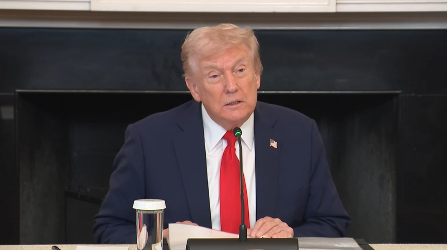 A White House official speaks during a briefing on the NAEP 2024 results at a press conference table