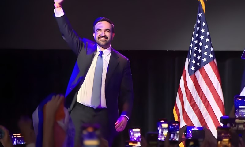 Zohran Mamdani celebrates election win on a stage