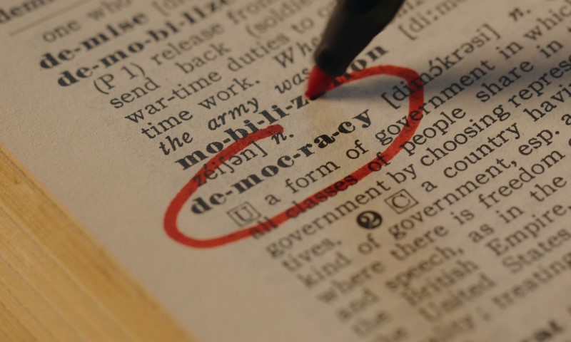 Democracy defined as a political system where the people govern themselves