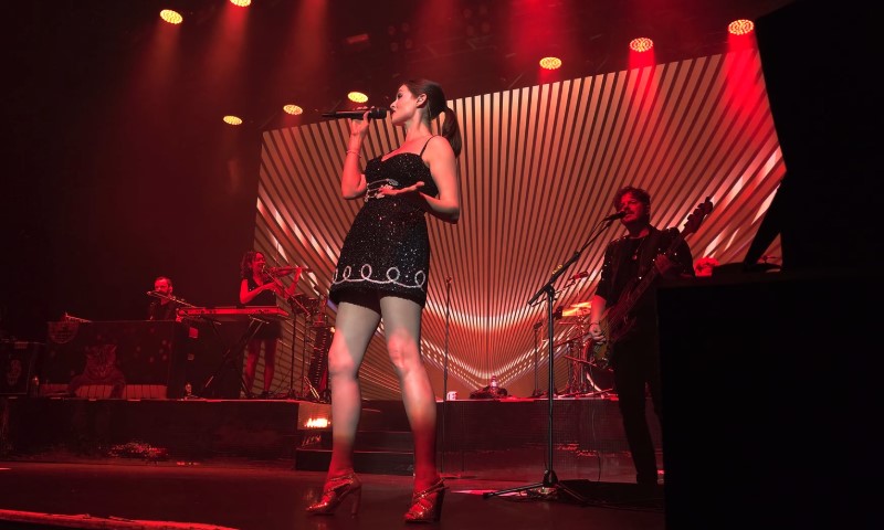 Sophie Ellis-Bextor singing on a concert stage