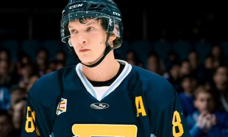Ilya Rozanov in a navy blue hockey jersey