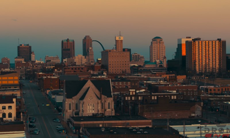 St. Louis at sunset with a warm glow over tall buildings