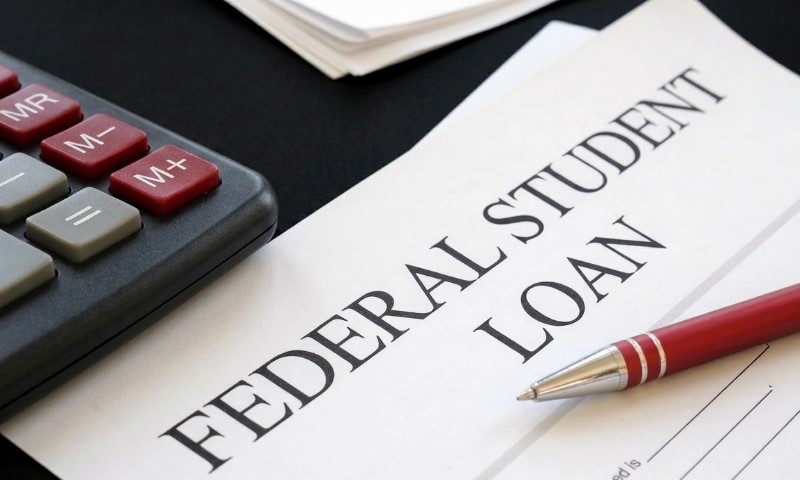 A document titled FEDERAL STUDENT LOAN is shown with a calculator and pen