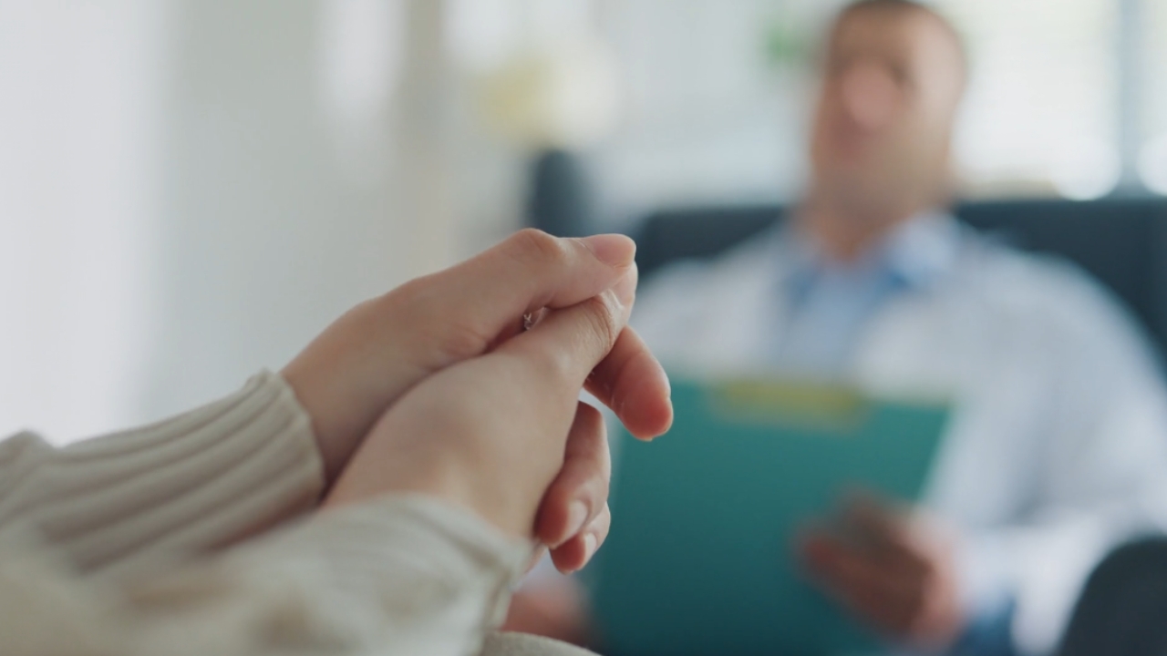 A patient meets a mental health professional at a clinic appointment.