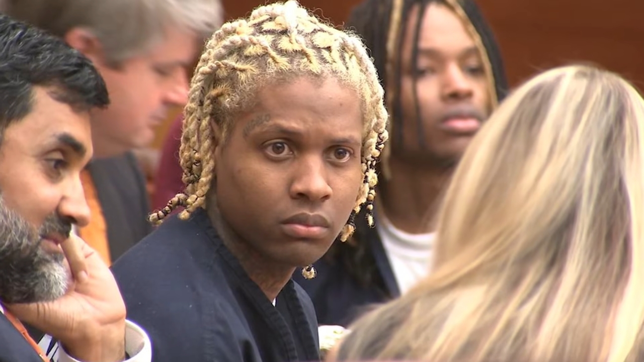 Lil Durk sits in court beside his legal team