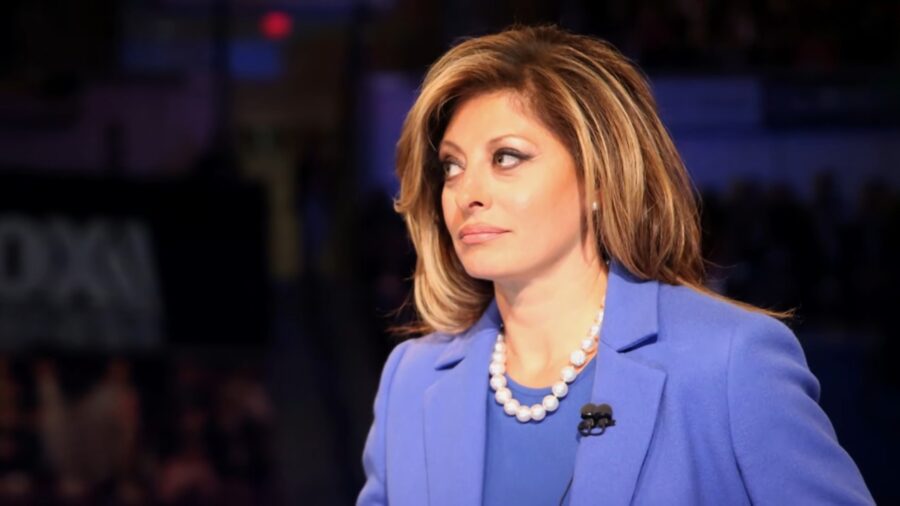Maria Bartiromo in a blue blazer sits in a television studio
