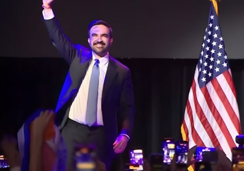 Zohran Mamdani celebrates election win on a stage