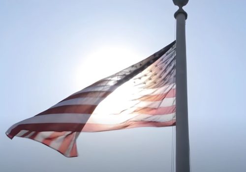 American flag waving on a pole