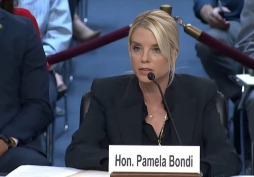 Hon. Pamela Bondi speaking at a formal hearing,