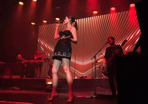 Sophie Ellis-Bextor singing on a concert stage