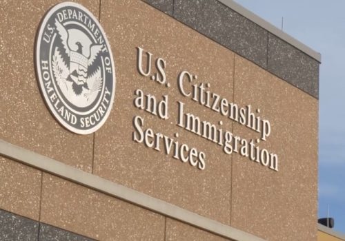 US Citizenship and Immigration Services logo featuring an eagle and shield